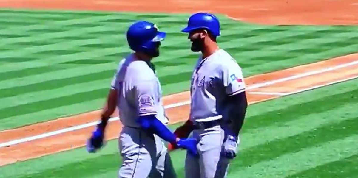 Two Baseball Players Celebrate Home Run With A Double Crotch Grab 