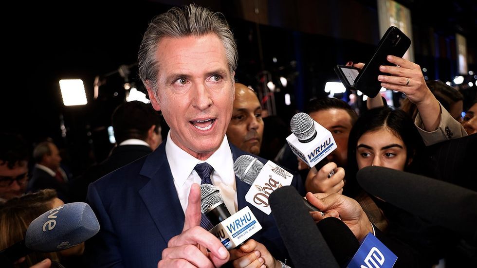 California Governor Gavin Newsom talks to journalists