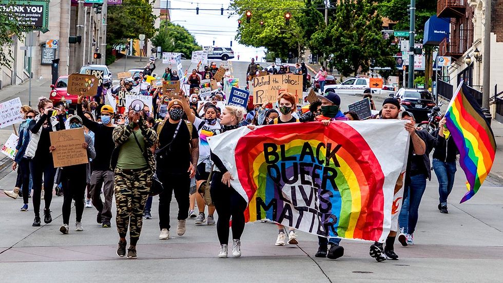 CEO Message lgbtq Pride Parade signs black queer lives matter rainbow flag