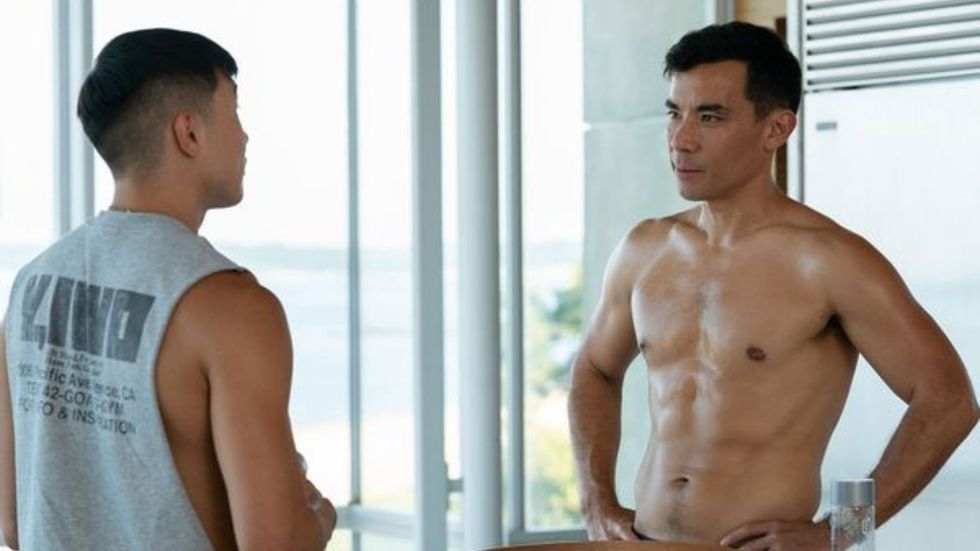 Joel Kim Booster and Conrad Ricamora in Hulu's gay rom-com 'Fire Island.'