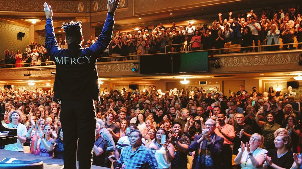 Jon Batiste performs in front of a sold out crowd and receives a standing ovation as part of the Virginia Film Festival premiere of American Symphony